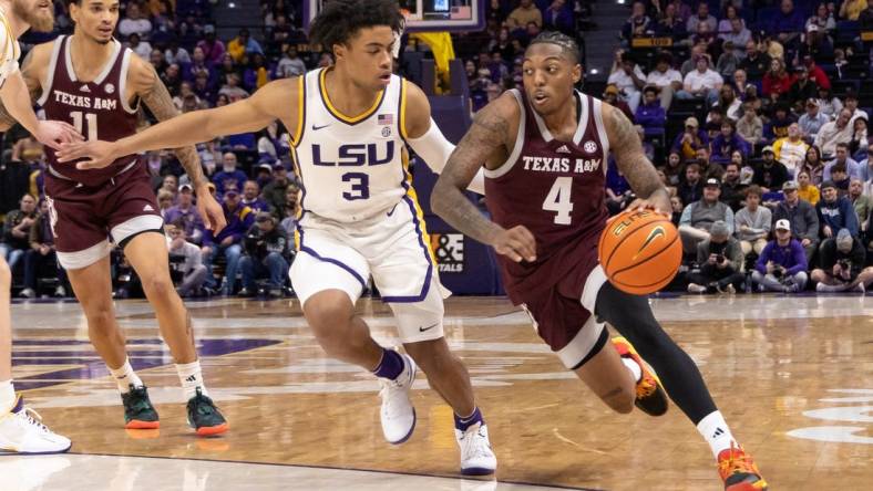 Jan 20, 2024; Baton Rouge, Louisiana, USA;  Texas A&M Aggies guard Wade Taylor IV (4) dribbles against LSU Tigers guard Jalen Cook (3) during the second half at Pete Maravich Assembly Center. Mandatory Credit: Stephen Lew-USA TODAY Sports