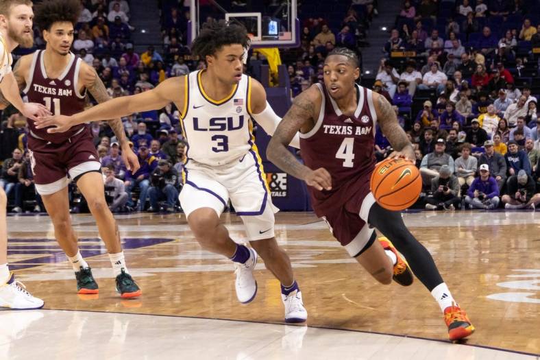 Jan 20, 2024; Baton Rouge, Louisiana, USA;  Texas A&M Aggies guard Wade Taylor IV (4) dribbles against LSU Tigers guard Jalen Cook (3) during the second half at Pete Maravich Assembly Center. Mandatory Credit: Stephen Lew-USA TODAY Sports