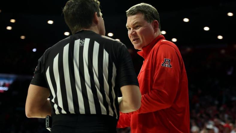 Jan 20, 2024; Tucson, Arizona, USA; Arizona Wildcats head coach Tommy Lloyd talks to the referee during a timeout against the UCLA Bruins during the second half at McKale Center. Mandatory Credit: Zachary BonDurant-USA TODAY Sports