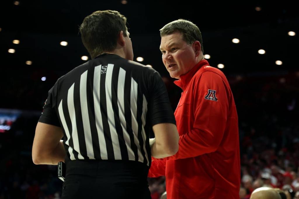 Jan 20, 2024; Tucson, Arizona, USA; Arizona Wildcats head coach Tommy Lloyd talks to the referee during a timeout against the UCLA Bruins during the second half at McKale Center. Mandatory Credit: Zachary BonDurant-USA TODAY Sports