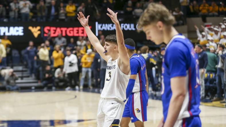 Jan 20, 2024; Morgantown, West Virginia, USA; West Virginia Mountaineers guard Kerr Kriisa (3) celebrates late in the second half against the Kansas Jayhawks at WVU Coliseum. Mandatory Credit: Ben Queen-USA TODAY Sports