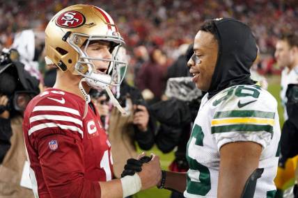 January 20, 2024; Santa Clara, CA, USA; Green Bay Packers safety Anthony Johnson Jr. (36) and San Francisco 49ers quarterback Brock Purdy (13) shake hands after the 2024 NFC divisional round game at Levi's Stadium. Mandatory Credit: Kyle Terada-USA TODAY Sports