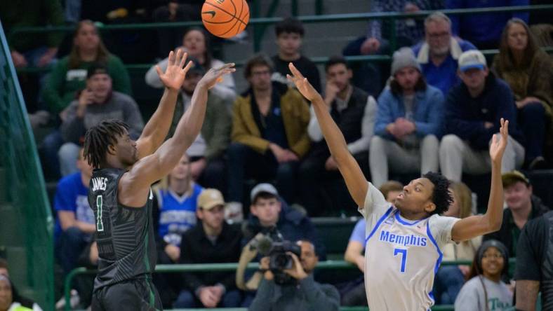 Jan 21, 2024; New Orleans, Louisiana, USA; Tulane Green Wave guard Sion James (1) shoots over Memphis Tigers forward Nae'Qwan Tomlin (7) during the first half at Avron B. Fogelman Arena in Devlin Fieldhouse. Mandatory Credit: Matthew Hinton-USA TODAY Sports