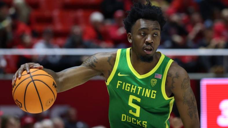 Jan 21, 2024; Salt Lake City, Utah, USA; Oregon Ducks guard Jermaine Couisnard (5) dribbles the ball against the Utah Utes during the first half at Jon M. Huntsman Center. Mandatory Credit: Rob Gray-USA TODAY Sports