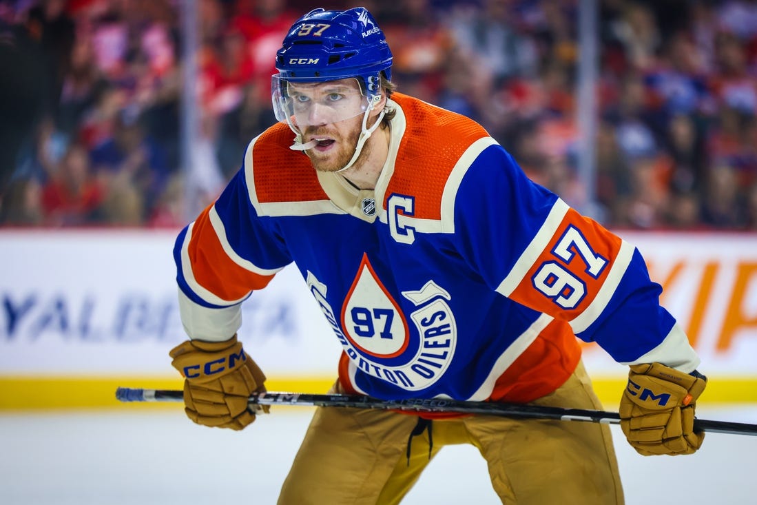 Jan 20, 2024; Calgary, Alberta, CAN; Edmonton Oilers center Connor McDavid (97) during the face off against the Calgary Flames during the first period at Scotiabank Saddledome. Mandatory Credit: Sergei Belski-USA TODAY Sports