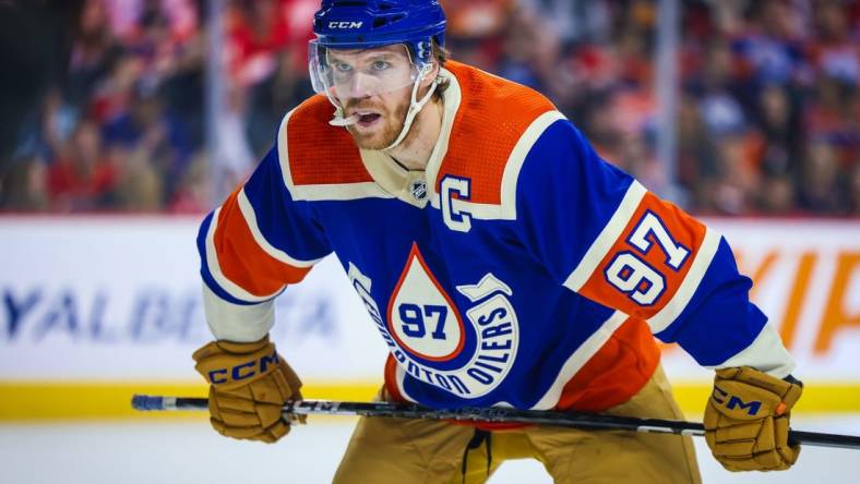 Jan 20, 2024; Calgary, Alberta, CAN; Edmonton Oilers center Connor McDavid (97) during the face off against the Calgary Flames during the first period at Scotiabank Saddledome. Mandatory Credit: Sergei Belski-USA TODAY Sports