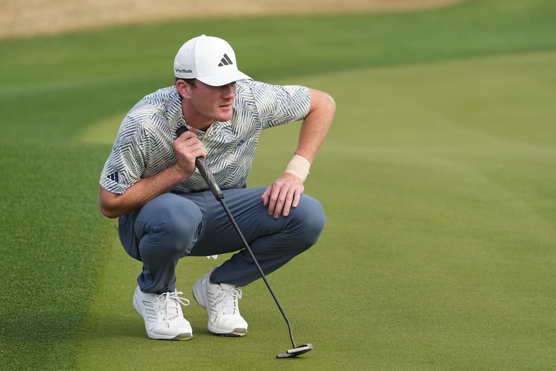 Jan 21, 2024; La Quinta, California, USA; Nick Dunlap lines up a putt on the third green during the final round of The American Express golf tournament at PGA West Stadium Course. Mandatory Credit: Ray Acevedo-USA TODAY Sports