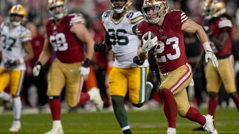 San Francisco 49ers running back Christian McCaffrey (23) scores a touchdown on a 39-yard run during the third quarter of their NFC divisional playoff game Saturday, January 20, 2024 at Levi         Stadium in Santa Clara, California. The San Francisco 49ers beat the Green Bay Packers 24-21.