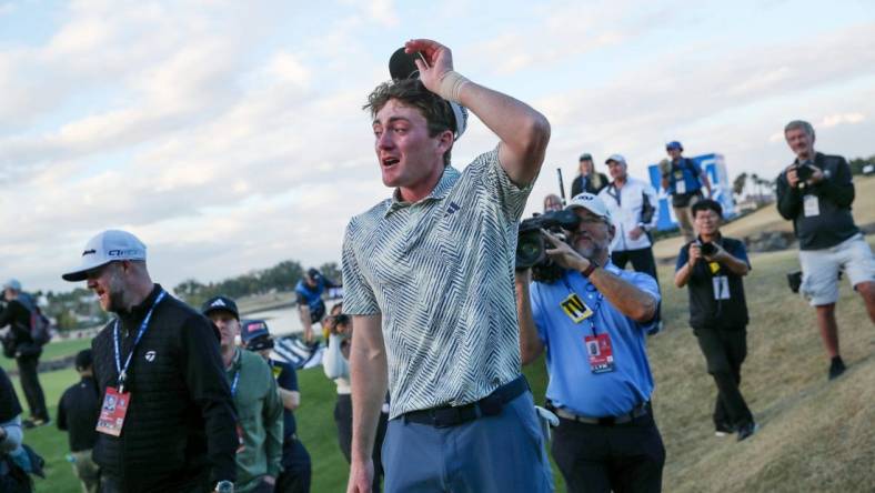 Nick Dunlap reacts after winning The American Express as the first amateur to win the PGA Tour event in 33 years in La Quinta, Calif., on Sunday, January 21, 2024.