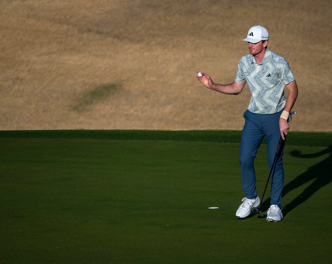 Nick Dunlap gestures to the gallery after putting for a birdie on the 16th green on the Pete Dye Stadium Course during the final round of The American Express at PGA West in La Quinta, Calif., Sunday, Jan. 21, 2024.