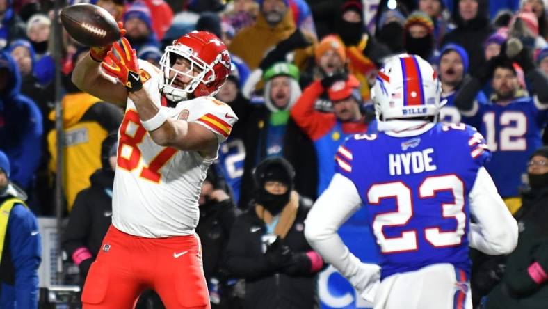 Jan 21, 2024; Orchard Park, New York, USA; Kansas City Chiefs tight end Travis Kelce (87) makes a catch for a touchdown against the Buffalo Bills in the first half of the 2024 AFC divisional round game at Highmark Stadium. Mandatory Credit: Mark Konezny-USA TODAY Sports