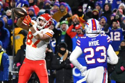 Jan 21, 2024; Orchard Park, New York, USA; Kansas City Chiefs tight end Travis Kelce (87) makes a catch for a touchdown against the Buffalo Bills in the first half of the 2024 AFC divisional round game at Highmark Stadium. Mandatory Credit: Mark Konezny-USA TODAY Sports
