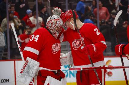 Jan 21, 2024; Detroit, Michigan, USA; Detroit Red Wings goaltender Alex Lyon (34) is congratulated by Detroit Red Wings defenseman Olli Maatta (2) at the end of the game against the Tampa Bay Lightning at Little Caesars Arena. Mandatory Credit: Brian Bradshaw Sevald-USA TODAY Sports