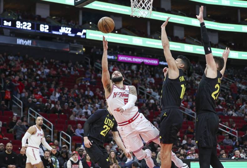 Jan 20, 2024; Houston, Texas, USA; Houston Rockets guard Fred VanVleet (5) shoots the ball during the game against the Utah Jazz at Toyota Center. Mandatory Credit: Troy Taormina-USA TODAY Sports