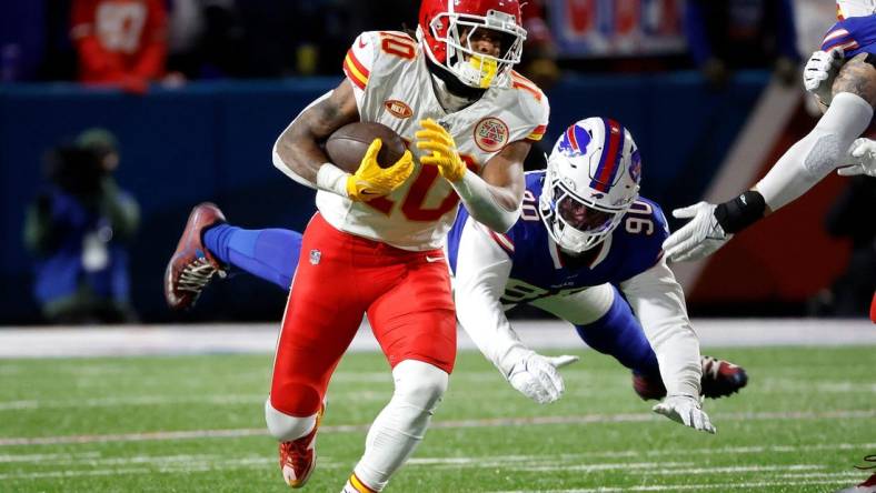 Kansas City Chiefs running back Isiah Pacheco (10) beats a tackle.