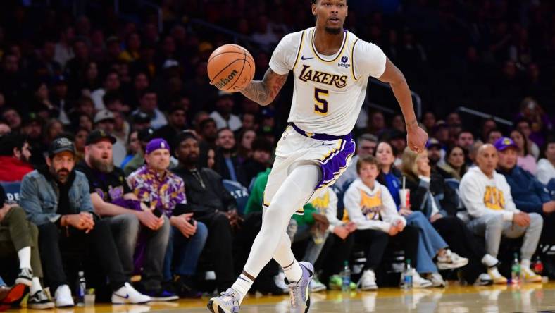 Jan 21, 2024; Los Angeles, California, USA; Los Angeles Lakers forward Cam Reddish (5) moves to the basket against the Portland Trail Blazers during the second half at Crypto.com Arena. Mandatory Credit: Gary A. Vasquez-USA TODAY Sports