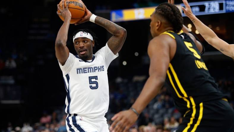 Jan 15, 2024; Memphis, Tennessee, USA; Memphis Grizzlies guard Vince Williams Jr. (5) passes the ball during the first half against the Golden State Warriors at FedExForum. Mandatory Credit: Petre Thomas-USA TODAY Sports