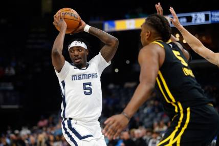 Jan 15, 2024; Memphis, Tennessee, USA; Memphis Grizzlies guard Vince Williams Jr. (5) passes the ball during the first half against the Golden State Warriors at FedExForum. Mandatory Credit: Petre Thomas-USA TODAY Sports