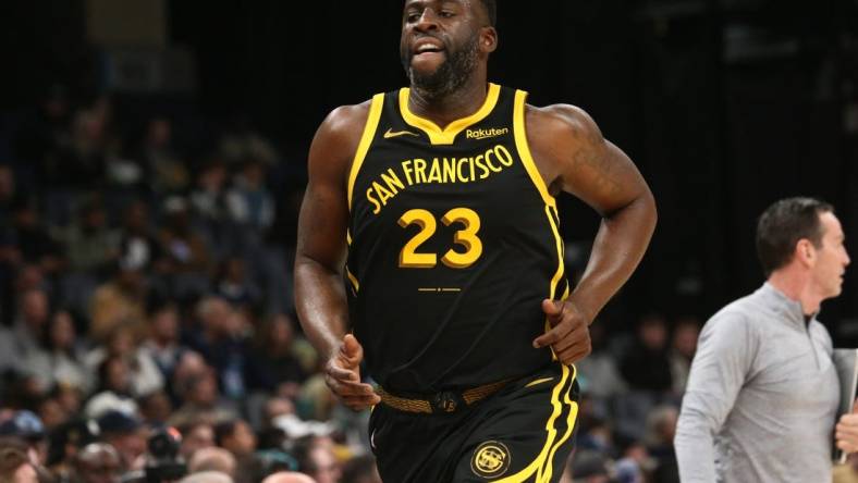 Jan 15, 2024; Memphis, Tennessee, USA; Golden State Warriors forward Draymond Green (23) runs toward the bench during the second half against the Memphis Grizzlies  at FedExForum. Mandatory Credit: Petre Thomas-USA TODAY Sports