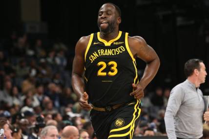 Jan 15, 2024; Memphis, Tennessee, USA; Golden State Warriors forward Draymond Green (23) runs toward the bench during the second half against the Memphis Grizzlies  at FedExForum. Mandatory Credit: Petre Thomas-USA TODAY Sports