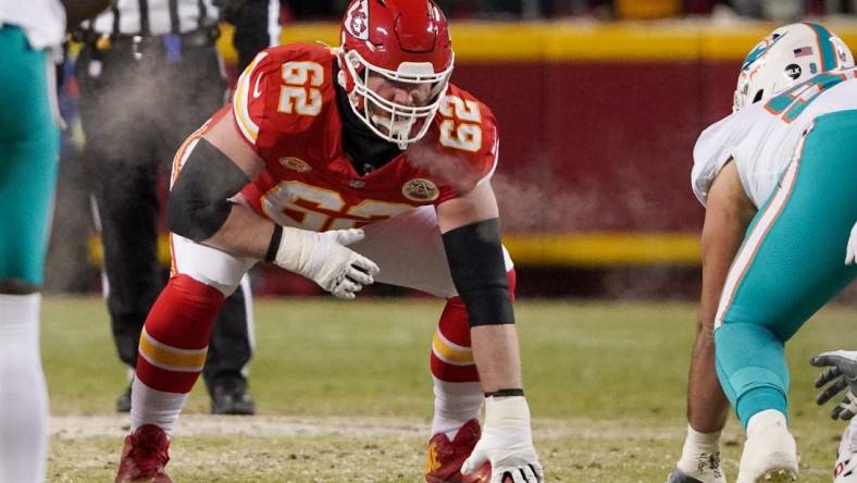 Jan 13, 2024; Kansas City, Missouri, USA; Kansas City Chiefs guard Joe Thuney (62) on the line of scrimmage against the Miami Dolphins in a 2024 AFC wild card game at GEHA Field at Arrowhead Stadium. Mandatory Credit: Denny Medley-USA TODAY Sports