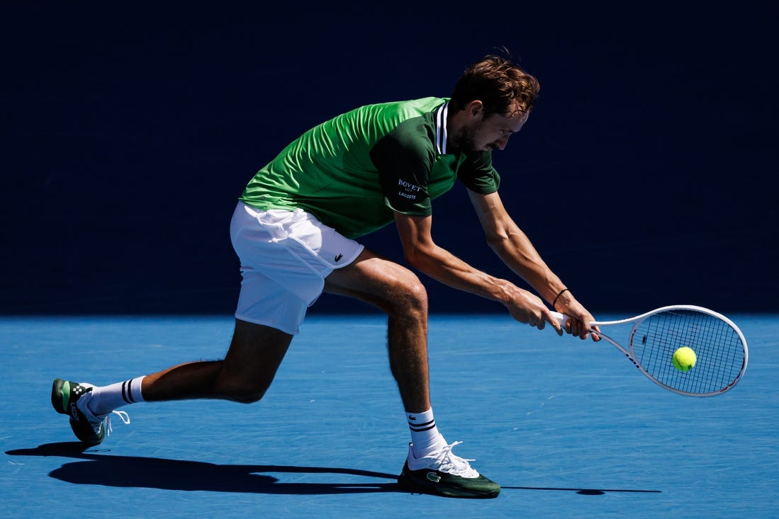 Jan 22, 2024; Melbourne, Victoria, Australia; Daniil Medvedev of Russia hits a shot against Nuno Borges of Portugal in the fourth round of the men   s singles at the Australian Open in Melbourne. Mandatory Credit: Mike Frey-USA TODAY Sports