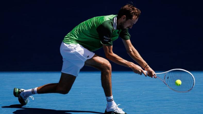 Jan 22, 2024; Melbourne, Victoria, Australia; Daniil Medvedev of Russia hits a shot against Nuno Borges of Portugal in the fourth round of the men   s singles at the Australian Open in Melbourne. Mandatory Credit: Mike Frey-USA TODAY Sports