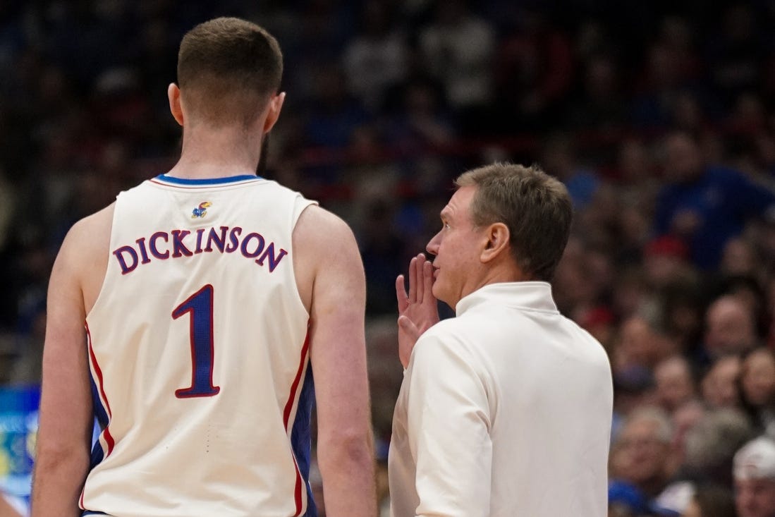 Jan 22, 2024; Lawrence, Kansas, USA; Kansas Jayhawks center Hunter Dickinson (1) talks with head coach Bill Self against the Cincinnati Bearcats during the first half at Allen Fieldhouse. Mandatory Credit: Denny Medley-USA TODAY Sports