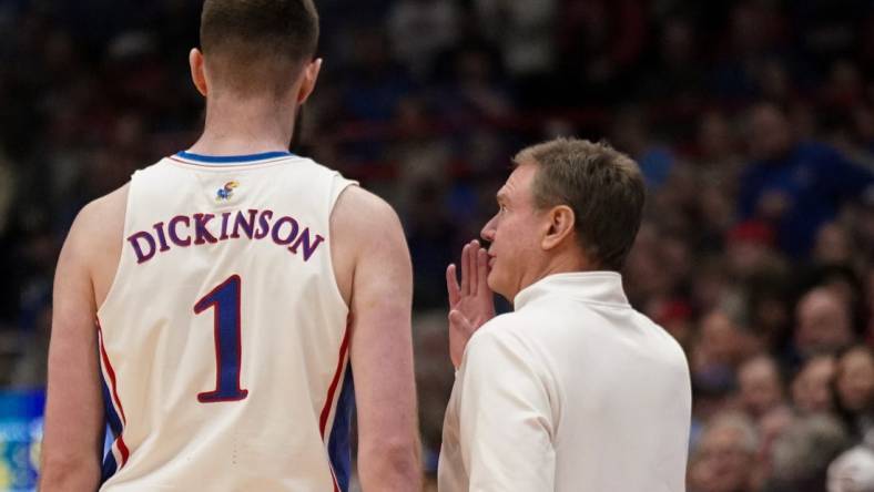 Jan 22, 2024; Lawrence, Kansas, USA; Kansas Jayhawks center Hunter Dickinson (1) talks with head coach Bill Self against the Cincinnati Bearcats during the first half at Allen Fieldhouse. Mandatory Credit: Denny Medley-USA TODAY Sports