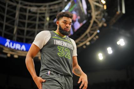 Jan 22, 2024; Minneapolis, Minnesota, USA; Minnesota Timberwolves center Karl-Anthony Towns (32) sets a franchise record with 62 points against the Charlotte Hornets at Target Center. Mandatory Credit: Brad Rempel-USA TODAY Sports