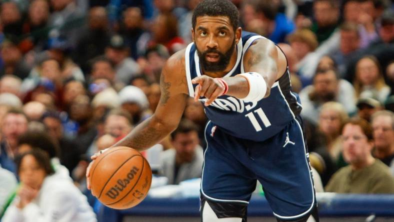 Jan 22, 2024; Dallas, Texas, USA; Dallas Mavericks guard Kyrie Irving (11) points while handling the ball during the fourth quarter against the Boston Celtics at American Airlines Center. Mandatory Credit: Andrew Dieb-USA TODAY Sports