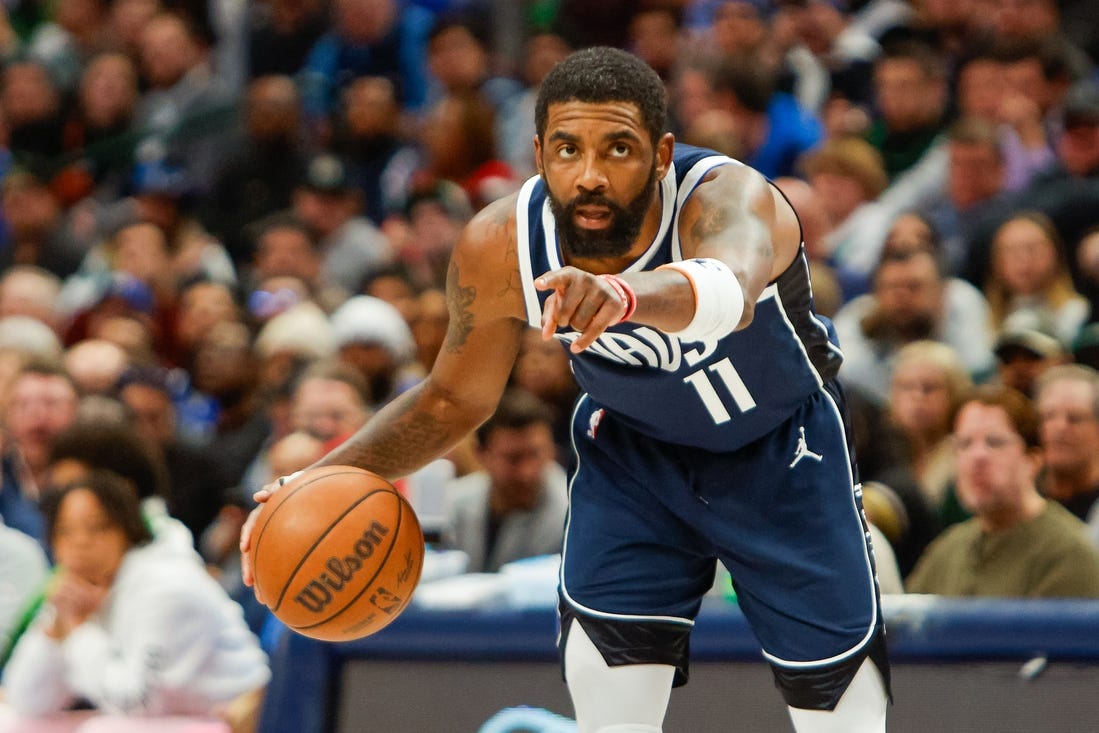 Jan 22, 2024; Dallas, Texas, USA; Dallas Mavericks guard Kyrie Irving (11) points while handling the ball during the fourth quarter against the Boston Celtics at American Airlines Center. Mandatory Credit: Andrew Dieb-USA TODAY Sports