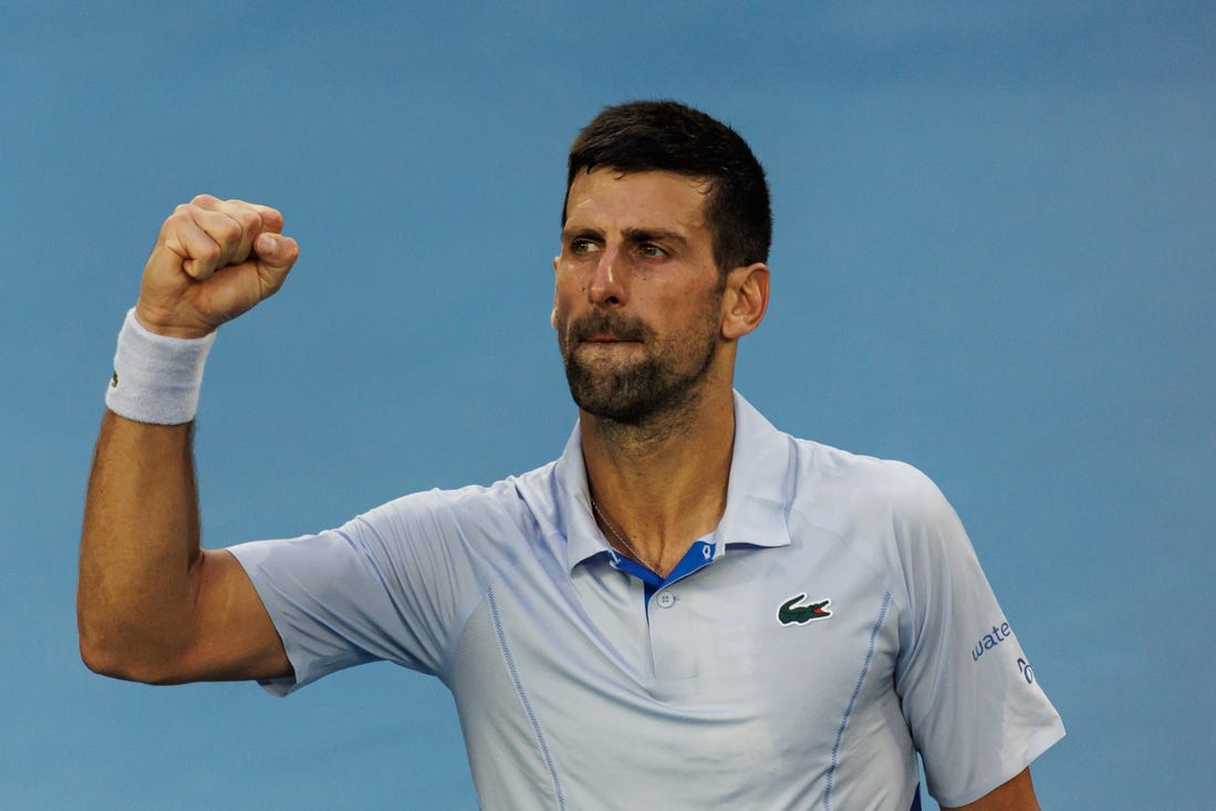 Jan 23, 2024; Melbourne, Victoria, Australia; Novak Djokovic of Serbia celebrates his victory against Taylor Fritz of the United States in the quarter final of the men s singles. Mandatory Credit: Mike Frey-USA TODAY Sports