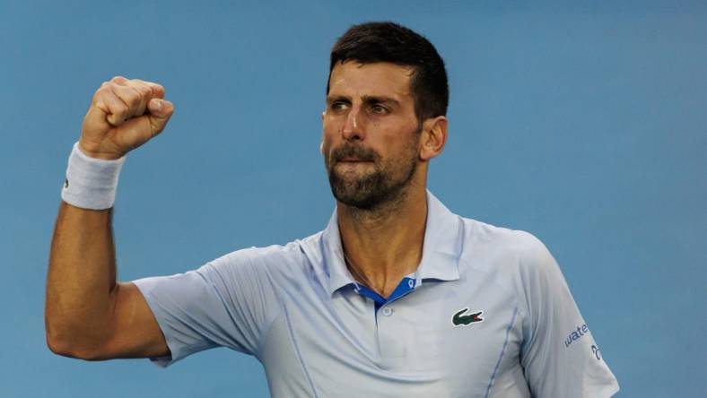 Jan 23, 2024; Melbourne, Victoria, Australia; Novak Djokovic of Serbia celebrates his victory against Taylor Fritz of the United States in the quarter final of the men s singles. Mandatory Credit: Mike Frey-USA TODAY Sports