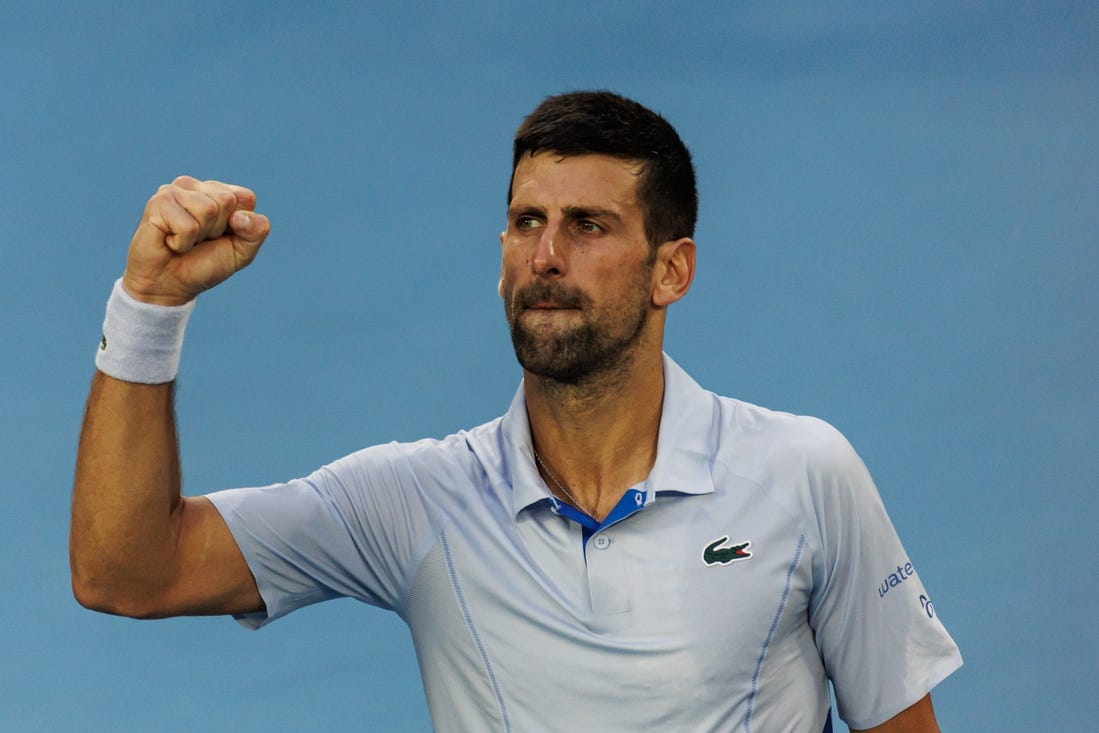 Jan 23, 2024; Melbourne, Victoria, Australia;  
Novak Djokovic of Serbia celebrates his victory against Taylor Fritz of the United States in the quarter final of the men s singles. Mandatory Credit: Mike Frey-USA TODAY Sports