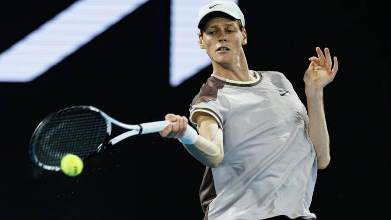 Jan 23, 2024; Melbourne, Victoria, Australia;  
Jannik Sinner of Italy in action against Andrey Rublev of Russia in the quarter final of the men s singles. Mandatory Credit: Mike Frey-USA TODAY Sports