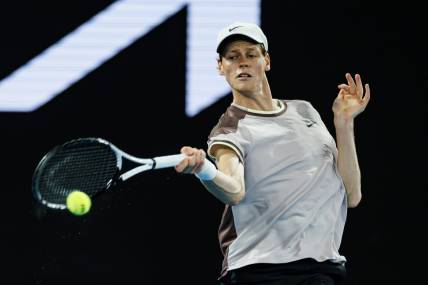 Jan 23, 2024; Melbourne, Victoria, Australia;  
Jannik Sinner of Italy in action against Andrey Rublev of Russia in the quarter final of the men s singles. Mandatory Credit: Mike Frey-USA TODAY Sports