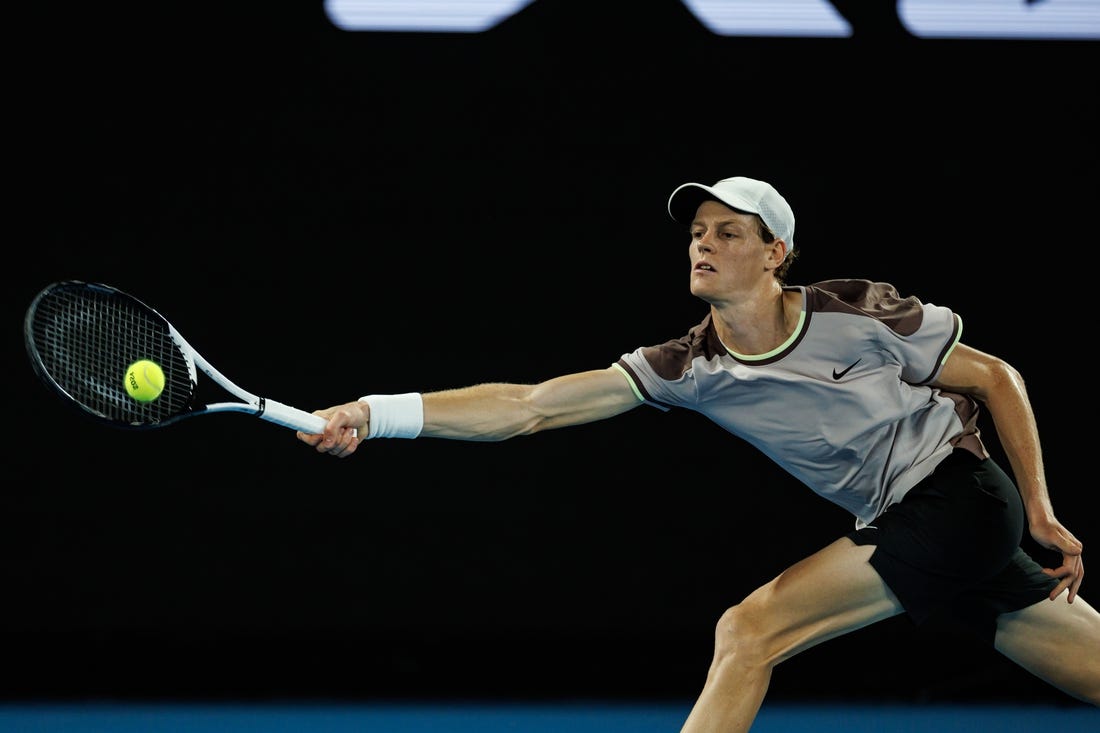 Jan 23, 2024; Melbourne, Victoria, Australia;  
Jannik Sinner of Italy in action against Andrey Rublev of Russia in the quarter final of the men s singles. Mandatory Credit: Mike Frey-USA TODAY Sports