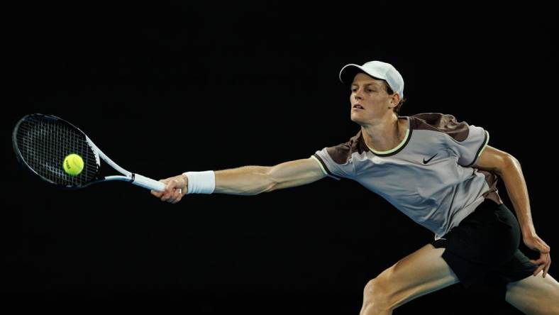 Jan 23, 2024; Melbourne, Victoria, Australia;  
Jannik Sinner of Italy in action against Andrey Rublev of Russia in the quarter final of the men s singles. Mandatory Credit: Mike Frey-USA TODAY Sports