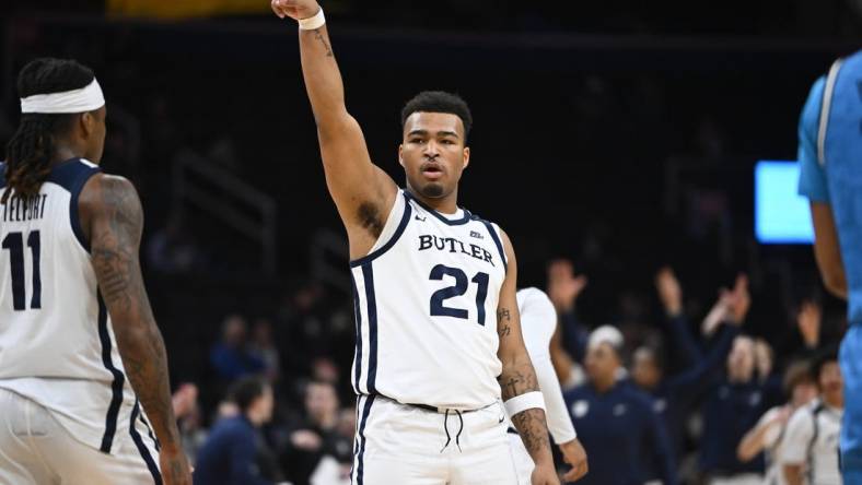 Jan 23, 2024; Washington, District of Columbia, USA; Butler Bulldogs guard Pierre Brooks (21) reacts after a three point basket against the Butler Bulldogs during the first half at Capital One Arena. Mandatory Credit: Brad Mills-USA TODAY Sports