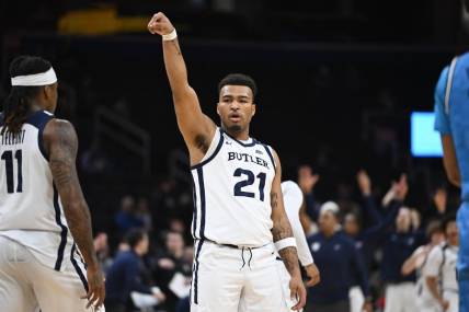 Jan 23, 2024; Washington, District of Columbia, USA; Butler Bulldogs guard Pierre Brooks (21) reacts after a three point basket against the Butler Bulldogs during the first half at Capital One Arena. Mandatory Credit: Brad Mills-USA TODAY Sports