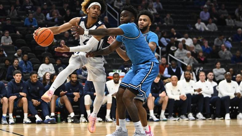 Jan 23, 2024; Washington, District of Columbia, USA; Butler Bulldogs guard DJ Davis (4) passes around Georgetown Hoyas guard Jay Heath (5) during the first half at Capital One Arena. Mandatory Credit: Brad Mills-USA TODAY Sports