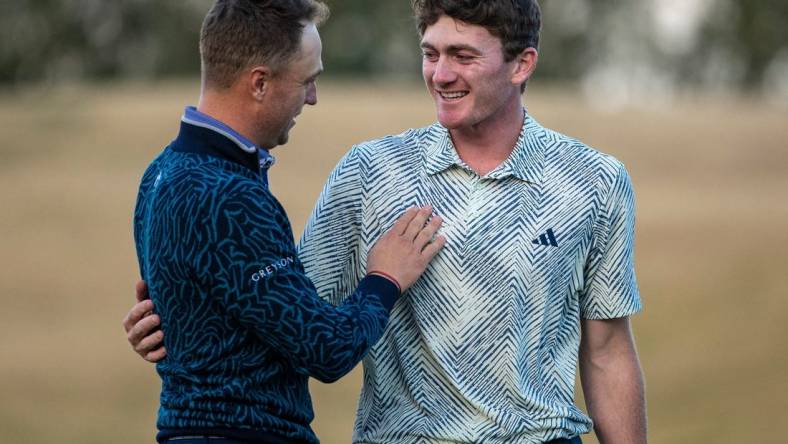 Nick Dunlap (right) embraces Justin Thomas after winning the final round of The American Express at PGA West in La Quinta, Calif., Sunday, Jan. 21, 2024.