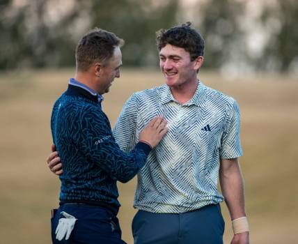 Nick Dunlap (right) embraces Justin Thomas after winning the final round of The American Express at PGA West in La Quinta, Calif., Sunday, Jan. 21, 2024.