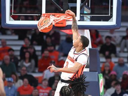 Jan 23, 2024; Syracuse, New York, USA; Syracuse Orange forward Benny Williams (13) dunks the ball against the Florida State Seminoles in the first half at the JMA Wireless Dome. Mandatory Credit: Mark Konezny-USA TODAY Sports