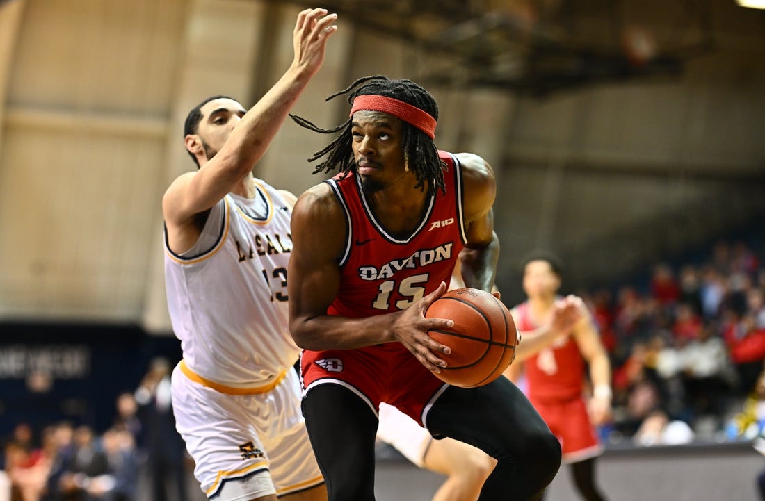 Jan 23, 2024; Philadelphia, Pennsylvania, USA; Dayton Flyers forward DaRon Holmes II (15) controls the ball against La Salle Explorers guard Daeshon Shepherd (13) in the first half at Tom Gola Arena at TruMark Financial Center. Mandatory Credit: Kyle Ross-USA TODAY Sports