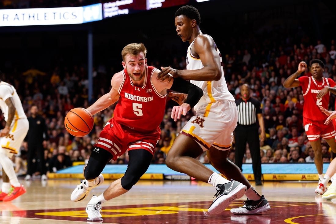 Jan 23, 2024; Minneapolis, Minnesota, USA; Wisconsin Badgers forward Tyler Wahl (5) works around Minnesota Golden Gophers forward Pharrel Payne (21) during the second half at Williams Arena. Mandatory Credit: Matt Krohn-USA TODAY Sports