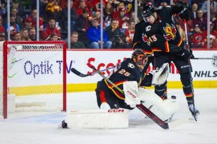 Jan 23, 2024; Calgary, Alberta, CAN; Calgary Flames goaltender Jacob Markstrom (25) makes a save against the St. Louis Blues during the first period at Scotiabank Saddledome. Mandatory Credit: Sergei Belski-USA TODAY Sports