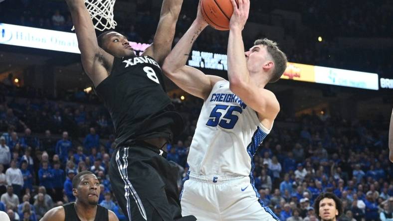 Jan 23, 2024; Omaha, Nebraska, USA;  Creighton Bluejays guard Baylor Scheierman (55) attempts a shot against Xavier Musketeers guard Quincy Olivari (8) in the second half at CHI Health Center Omaha. Mandatory Credit: Steven Branscombe-USA TODAY Sports