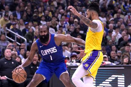 Jan 23, 2024; Los Angeles, California, USA; Los Angeles Clippers guard James Harden (1) is defended by Los Angeles Lakers guard D'Angelo Russell (1) in the first half at Crypto.com Arena. Mandatory Credit: Jayne Kamin-Oncea-USA TODAY Sports